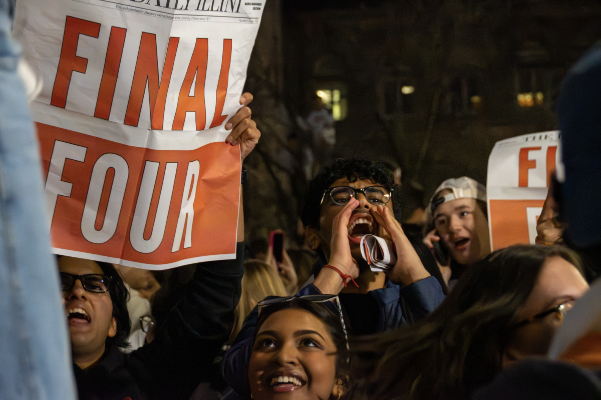 Students celebrate around the Alma Mater after a victory against Iowa, securing advancement to the Final Four on March 28.