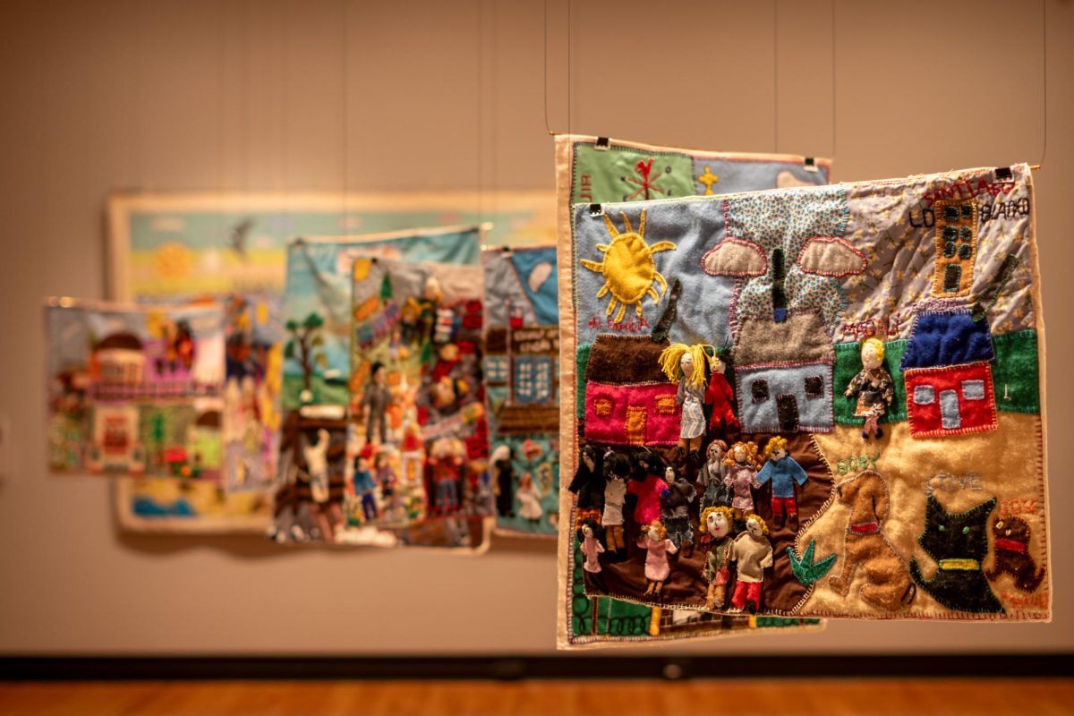 Textile artworks made by Chilean women representing both the personal histories of their creators and of cultural heritage sites in Chile. The Memorias de la Mujer Lotina: Arpilleras, Women and Coal in Chile exhibition is on display at the Krannert Art Museum until Sept. 6, 2026. 