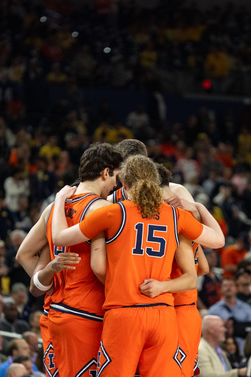 Illinois' starters for the Final Four game versus UConn huddle before tipoff on April 4.