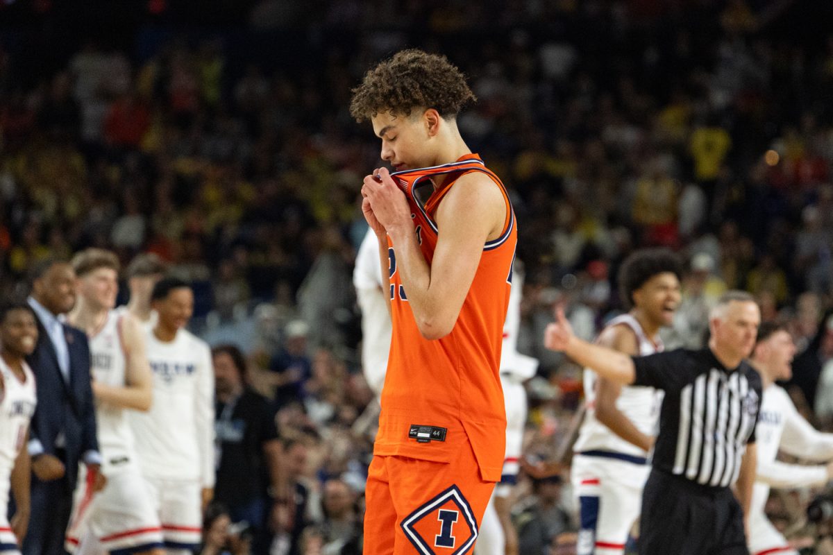 Freshman guard Keaton Wagler wipes his eyes with his jersey after Illinois' semifinal loss to UConn on April 4. 