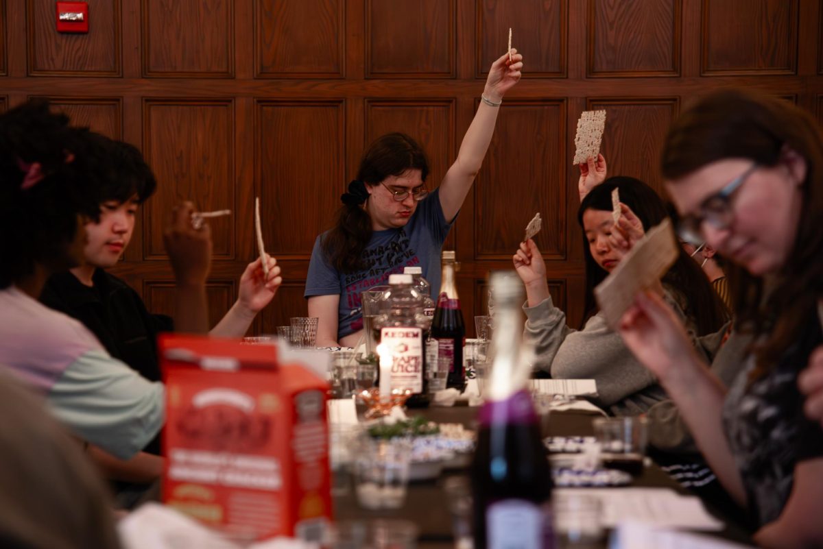 Community members read a program over dinner reflecting on themes of liberation, resistance and the cross-cultural impact of Springtime rituals. U-C Jews for Ceasefire held a “Solidarity Seder” on April 3 at the Latzer Hall in the YMCA building.