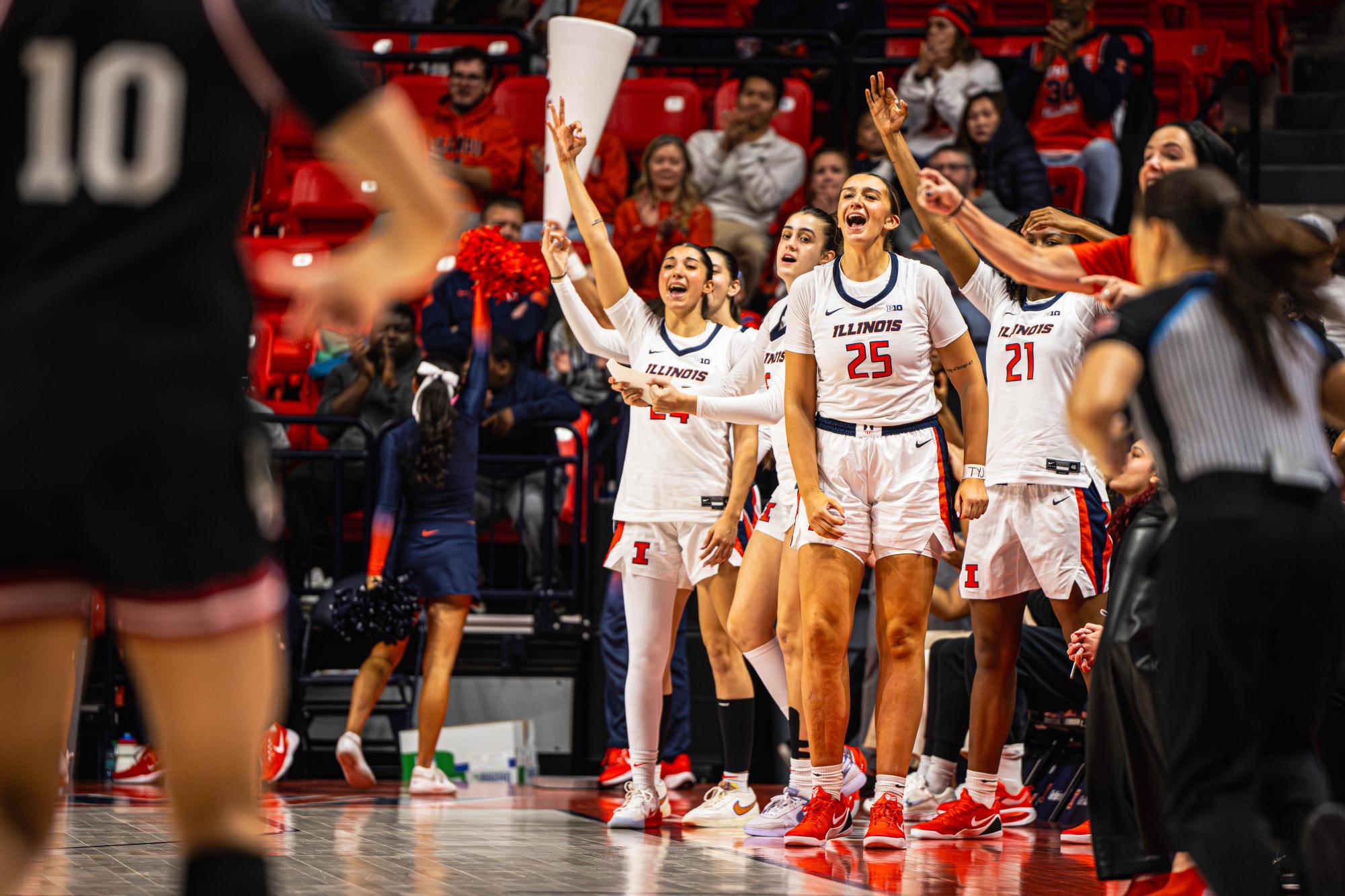 The Illinois bench celebrates a three point basket during their game against Indiana on Dec. 6, 2025. Illinois would go on to win the game 78-57.