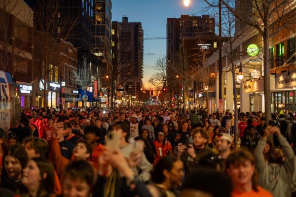 Students rush Green Street after Illinois’ win against Iowa in the Elite Eight to move the Illini to the Final Four.