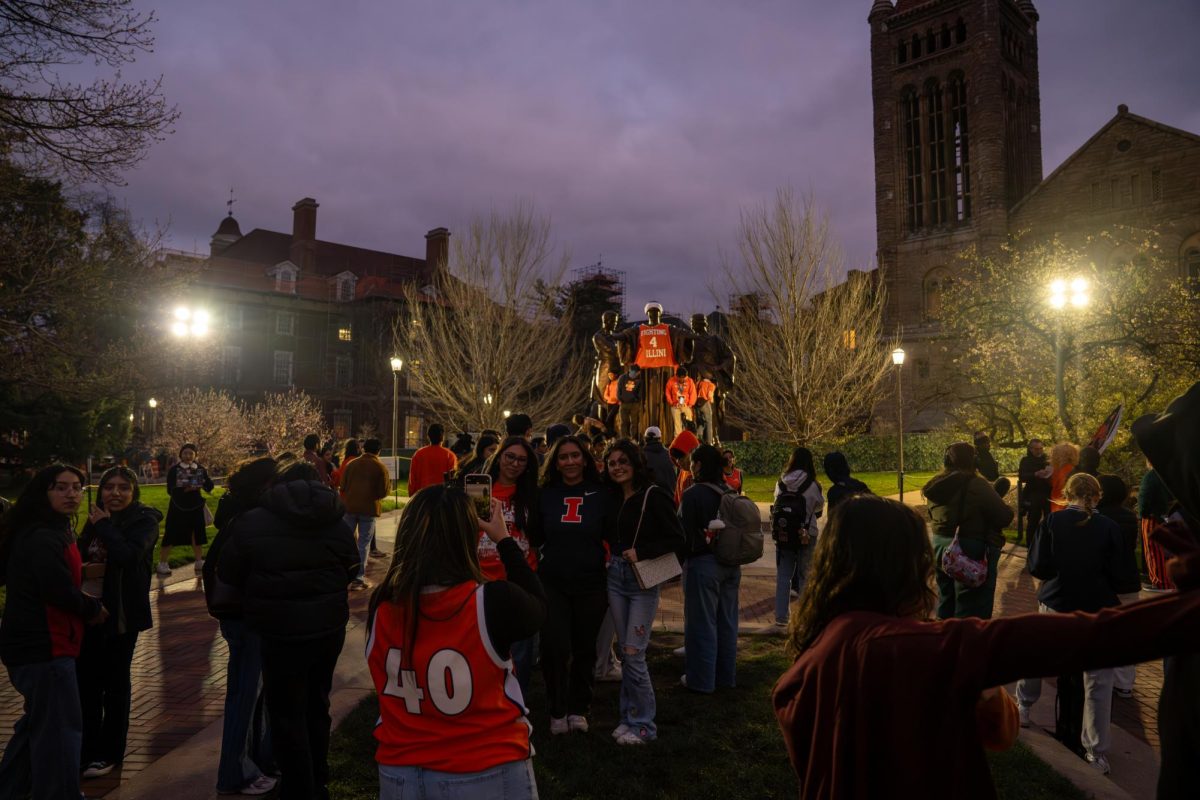 Illini fans take pictures at Alma Mater after Illinois lost its Final Four matchup against UConn on April 4.