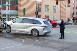 A UIPD officer takes the information from a car shortly after the collision.