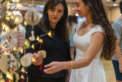 A display of paper ornaments caught their eyes.