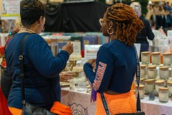 Starr Hollis, sophomore in LAS, and her mother Stacey Trammell-Christian look at candles at the Illini Union Board Craft and Vendor Fair.