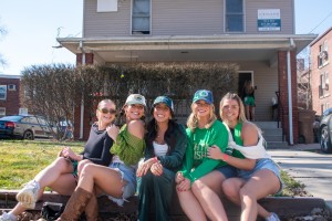 A group of senior girls sit outside their house before going out for the day on Saturday.