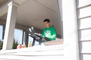 Ricky, a senior in LAS, prepares to DJ a house party on Saturday.