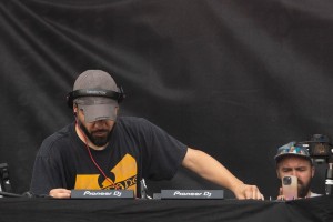 Skrillex at Lollapalooza adjusts his mixer.