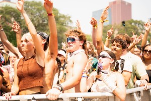Festival goers raise their hands as Skrillex’s set continues.