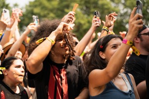 Crowd members raise their hands to Skrillex’s set.