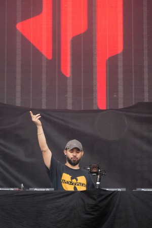 Skrillex encouraging the crowd to get excited.