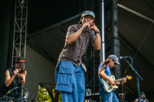 grentperez gestures a call while he sings a track to the Sunday audience.