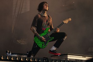 Tony Perry takes in the music as he performs on guitar.