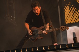 Bassist Jaime Preciado jams out while looking at the fans in the crowd.