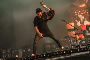 Bass player Jaime Preciado entertains at the front of the T-Mobile stage on Sunday.