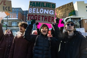 Protesters join in chants led by speakers during the walkout protesting ICE on Jan. 30. Members of the protest chanted "F--k ICE," "immigrants are welcome here" and called for a general strike.