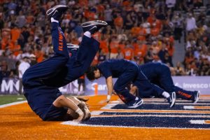 Illini cheerleaders line up and do pushups in the endzone to celebrate an Illinois touchdown Sept. 13. Illinois defeated Western Michigan in a 38-0 shutout.