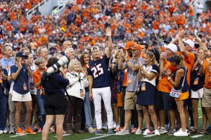 Larry Gies waves to the crowd as he is honored after his $100 million gift to the Illinois Division of Intercollegiate Athletics at the Illinois versus Western Michigan game on Sept. 13. The stadium was rededicated as Gies Memorial Stadium in September.