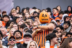 A fan in the Illinois student section busts a move in a Halloween costume for the dance cam at the Nov. 1 game.