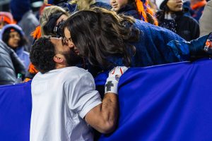 Junior linebacker TJ Griffin hoists himself up onto the wall for a post-game kiss after Illinois won the Music City Bowl on Dec. 30, 2025.