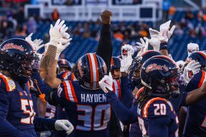 Illinois players put their hands in after a pre-game huddle at the Music City Bowl at Nissan Stadium in Nashville on Dec. 30, 2025.