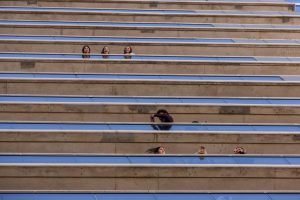People watch hundreds of protesters march down Green Street from the balconies of the high rise apartment at 309 E. Green on Jan. 30.