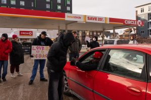 Anti-ICE protesters argue with a driver attempting to enter the Circle K located at the corner of First and Green Streets on Jan. 30.
