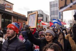 One protester holds a framed portrait of the Virgin of Guadalupe during the march on Jan. 30.