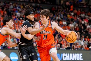 Illinois freshman forward David Mirković fights to dribble past a VCU defender, sophomore guard Brandon Jennings, March 21 in Greenville, South Carolina.