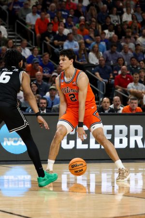 Junior wing Andrej Stojaković dribbles the ball between his legs against VCU March 21. Stojaković led Illinois with 21 points in the win.