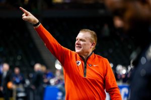 Head coach Brad Underwood points to the crowd of Illini fans waiting by the team’s tunnel after defeating VCU on March 21.