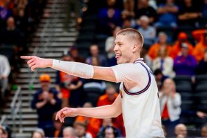 Graduate student forward Ben Humrichous celebrates after drilling a three on the left wing during the second half of Illinois’ 105-70 win over Penn in the first round of the NCAA tournament March 19. Humrichous shot 4 for 8 from long range in the victory.