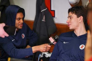 Senior guard AJ Redd interviews junior wing Andrej Stojaković March 20 at Bon Secours Wellness Arena before Illinois practices.