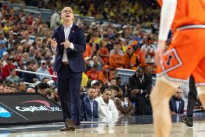 UConn head coach Dan Hurley shouts to his players after a possession change.