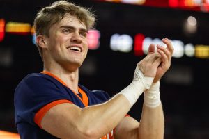 Junior cheerleader Anthony Hoffman leads Illinois fans in chants.
