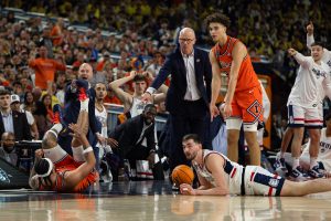 Freshman guard Keaton Wagler and UConn head coach Dan Hurley argue a call.