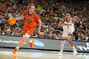 Junior forward Jake Davis takes the ball to the net after a steal.