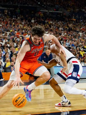 Freshman forward David Mirkovic maneuvers past UConn junior guard Silas Demary Jr.